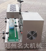 全自動鋁箔封口機(jī)側(cè)面靚照